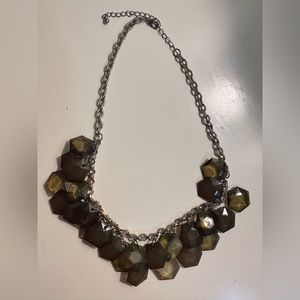 Green necklace.